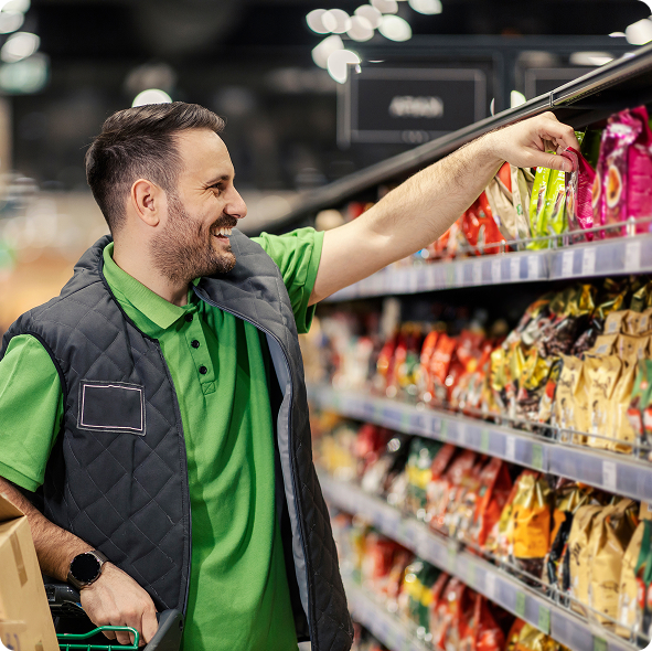 Shopper reaching for a snack on the shelf